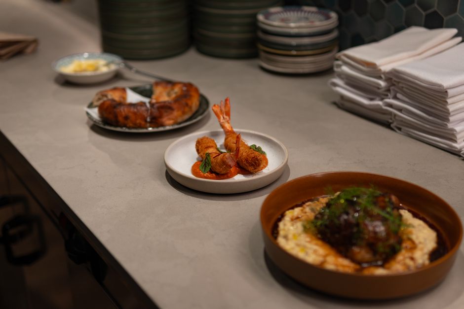 A selection of gourmet dishes beautifully arranged on an elegant countertop, showcasing culinary art.